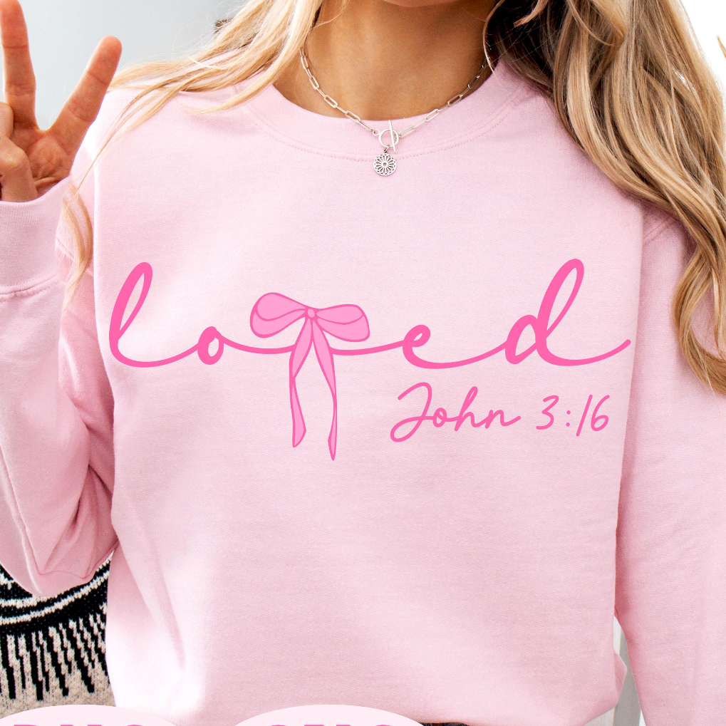 A person wearing a light pink crewneck sweatshirt with the word 'loved' in pink script and 'John 3:16' in smaller text below, shown in a cropped social-style listing image with 'PNG SVG' and 'Buy with Apple Pay' overlays.